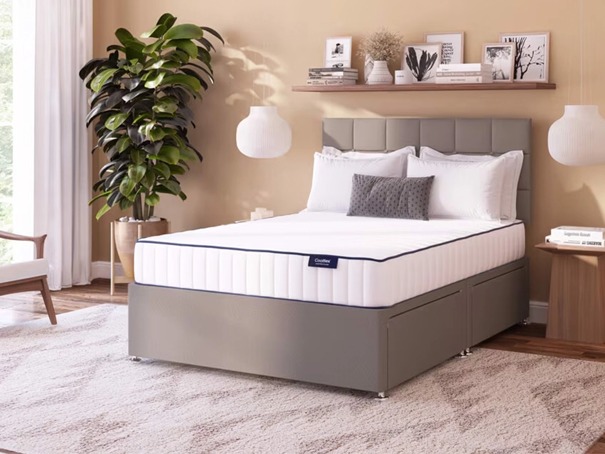 Angled view of Silentnight 1000 Pocket Memory Mattress on a beige divan base in a neutral bedroom