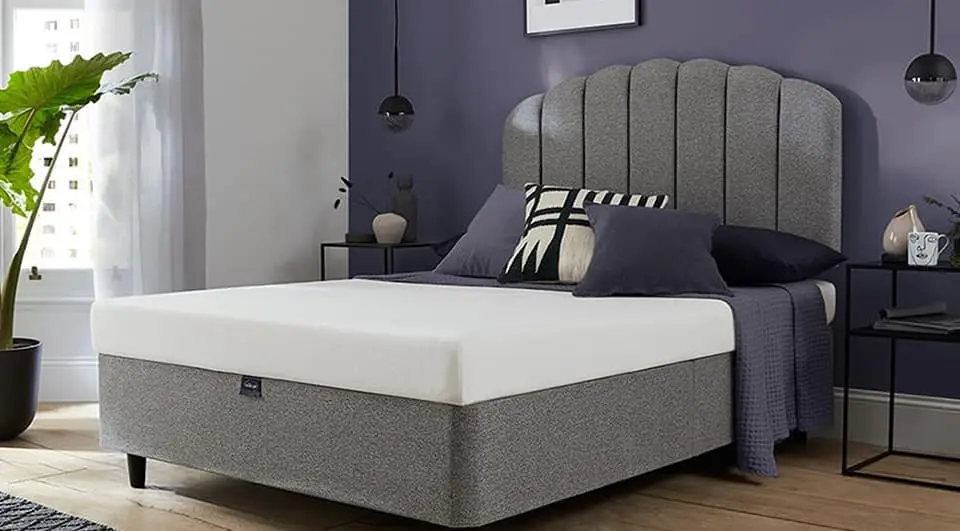 buying-mattress-on-budget-silentnight-comfortable-foam A Silentnight Comfortable Foam Mattress on a modern grey divan bed frame in a stylishly decorated bedroom.