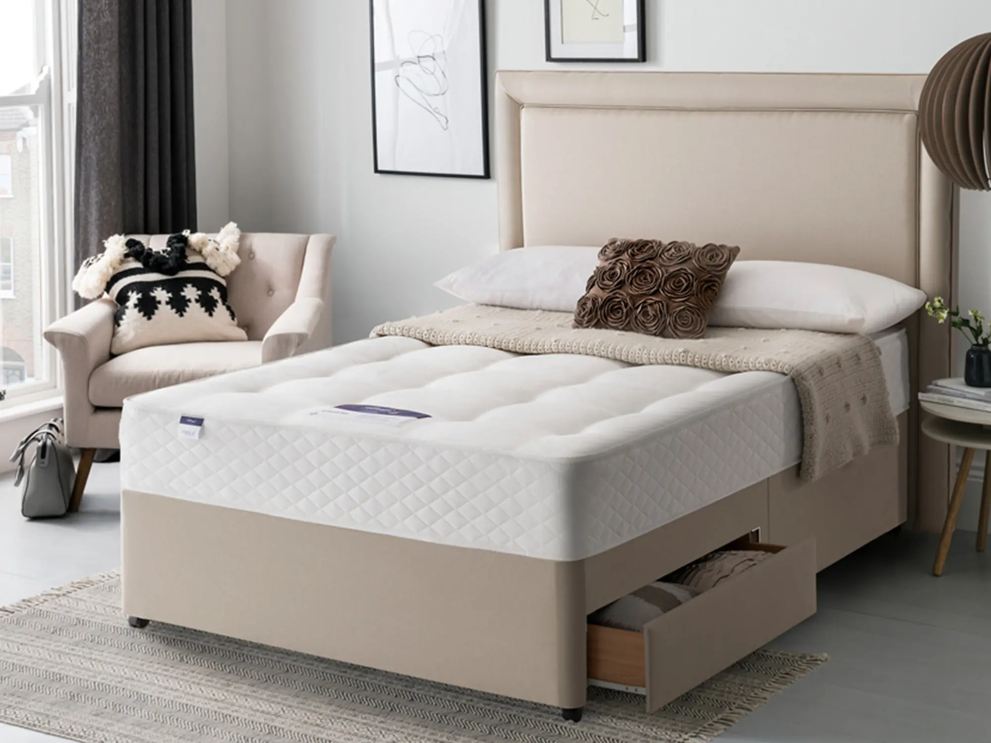 Silentnight Ortho Dream Star Mattress sat on a beige divan base in a stylish bedroom setting