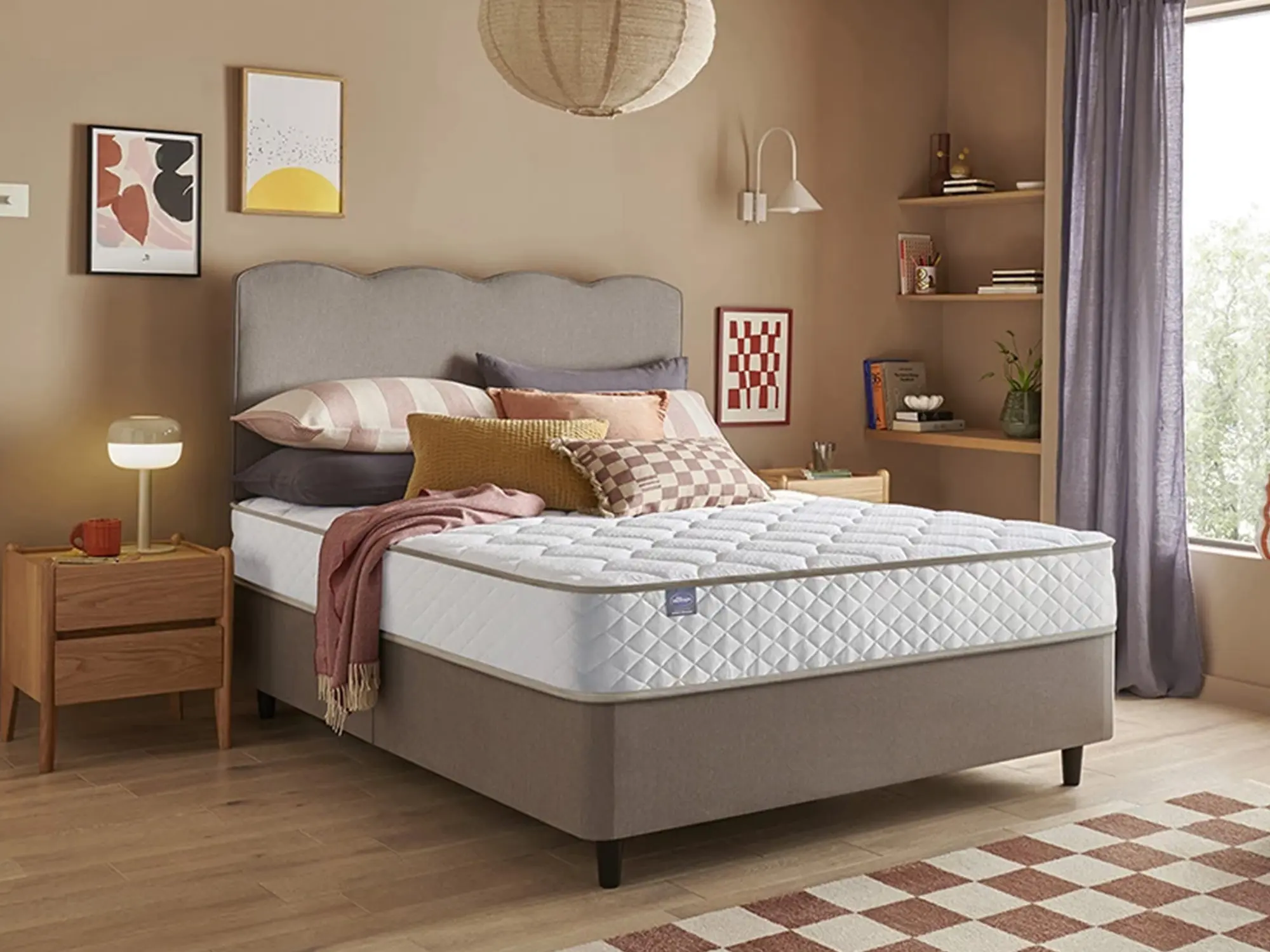 Silentnight Memory 1000 Pocket Mattress sat on a grey bed frame in a stylish bedroom