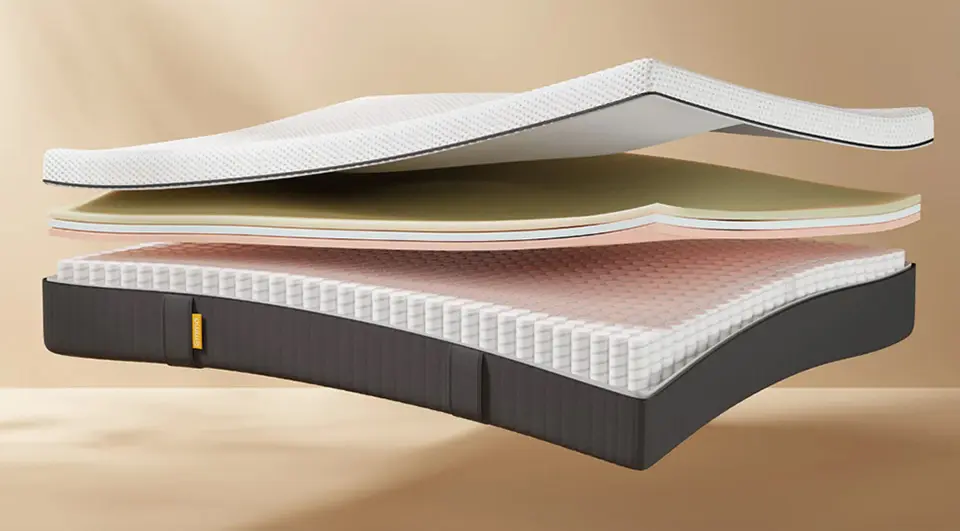 An internal view of the Emma Original mattress, displaying its classic hybrid design with a breathable top cover, pressure-relieving foam layers, and a supportive pocket spring foundation.
